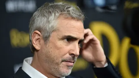 AFP Mexican director Alfonso Cuarn arrives for the Los Angeles premiere of "Roma" at the Egyptian theatre in Hollywood on 10 December, 2018.