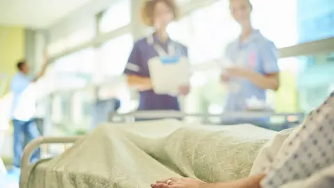 Getty Images Nurses with patient