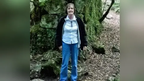 Essex Police Patricia Finnie standing in a wooded area
