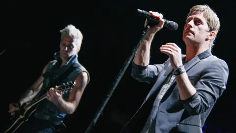 Getty Images Kyle Cook and Rob Thomas of Matchbox Twenty performing in 2013
