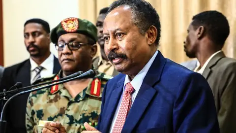 Anadolu Agency Member of Sudan's 'sovereign council' Abdullah Hamadok holds a press conference after swearing in ceremony at Presidential Palace in Khartoum, Sudan on August 21, 2019