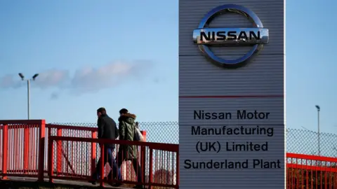 REUTERS/Phil Noble People walk into Nissan factory