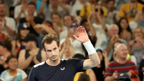 Reuters Andy Murray waves to the crowd after losing at the Melbourne Arena
