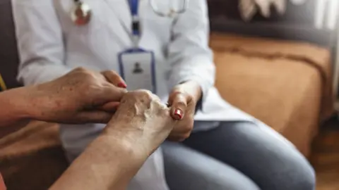 Getty Images Stock photograph of nurse with patient