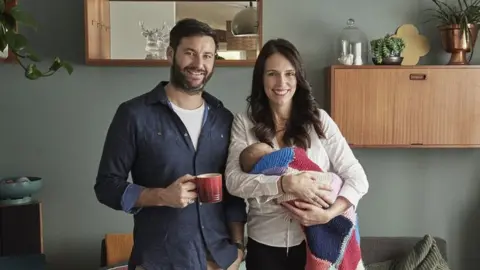 Getty Images Prime Minister Jacinda Ardern and partner Clarke Gayford pose with their baby daughter Neve Gayford