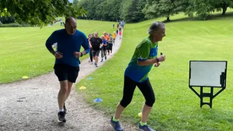Mark Ansell/BBC Runners in Roundhay Park