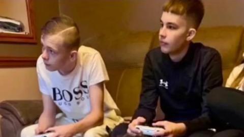 Best friends Mason and Max playing video games with each other