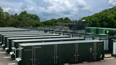 Statera Image shows a battery energy storage site with rows of green containers 