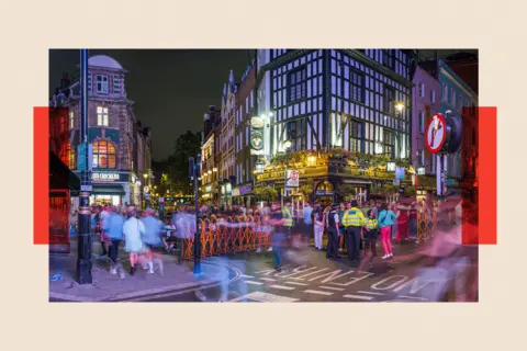 Getty Images London Soho nightlife showing crowds of people outside busy pubs 