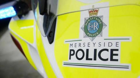 merseyside police logo on vehicle