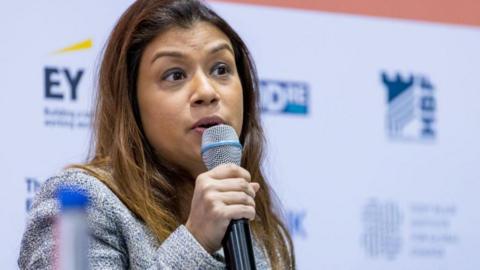 Tulip Siddiq speaking into microphone