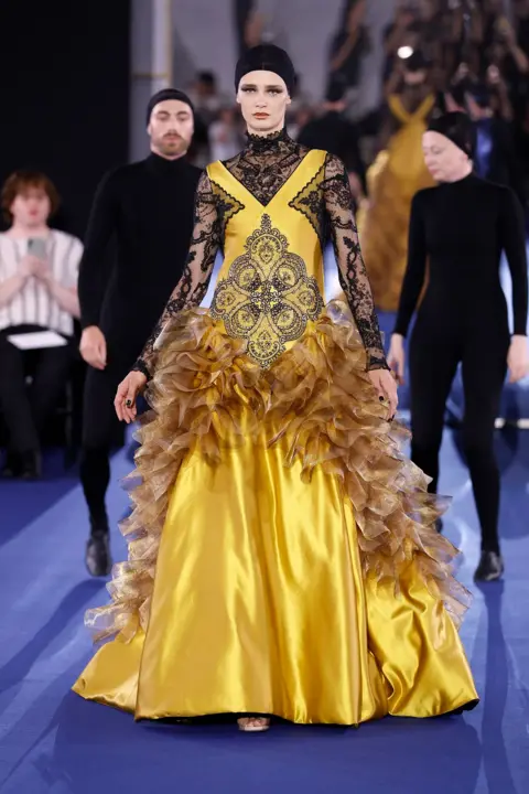 Benjamin Cremel/Getty Images A model walks the runway during the Alexis Mabille Haute Couture Fall/Winter 2026/2027 show as part of Paris Fashion Week on July 07, 2026 in Paris, France.