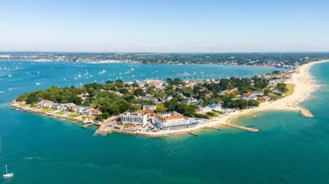 An aerial view of the Sandbanks peninsula, showing luxury seafront houses