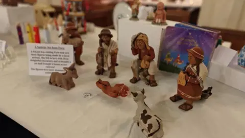 The Reverend Michael Bigg A nativity scene from Peru. It has figurines wearing traditional Peruvian clothing. 