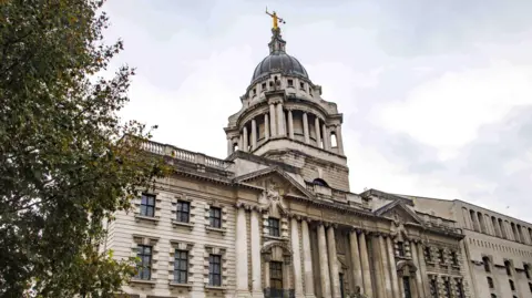 Reuters Exterior of central Criminal Court with Lady Justice atop