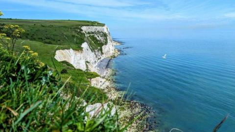 Wide view of the cliffs of Dover and blue sea 
