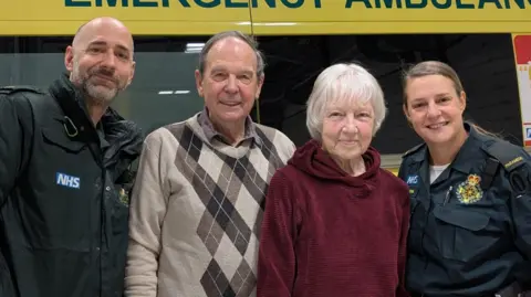 Associate ambulance practitioner Gabor Lajos, Brian and Janice Nuttall, and paramedic Imogen Baldock
