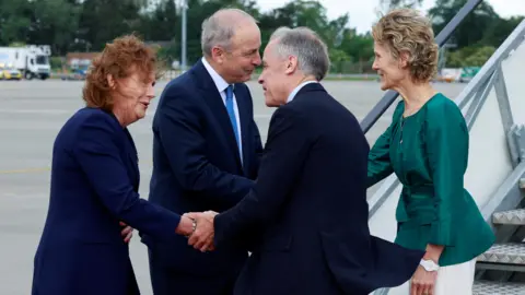 Conor O Mearain/Pool via REUTERS Canadian Prime Minister Mark Carney is welcomed by Taoiseach Micheal Martin at Dublin airport at the start of his visit to Ireland, June 13, 2026. Conor O Mearain/Pool via REUTERS
