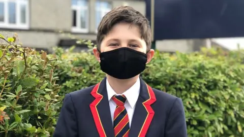 Enniskillen Royal Grammar School Hughie has to wear a face covering in some areas of his school