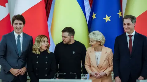 Reuters Zelensky (centre) with EU and Canadian leaders