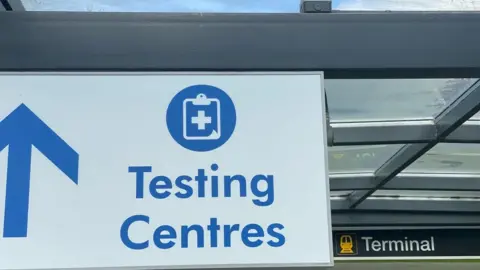 John Fairhall/BBC Testing sign at Stansted
