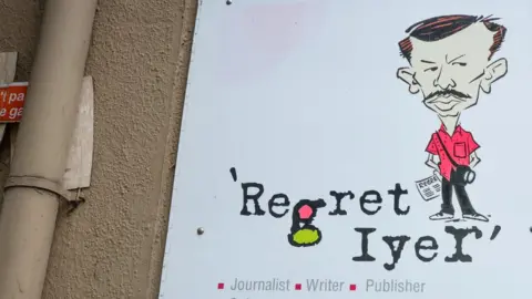 Asif Saud The nameplate outside Regret Iyer's door