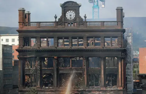 PA The charred Bank Buildings in Belfast city centre