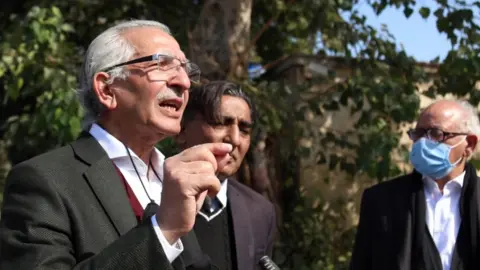 EPA Mehmood Ahmed Sheikh, the lawyer of British-born militant Ahmed Omar Saeed Sheikh, speaks to media representatives outside the Sindh High Court