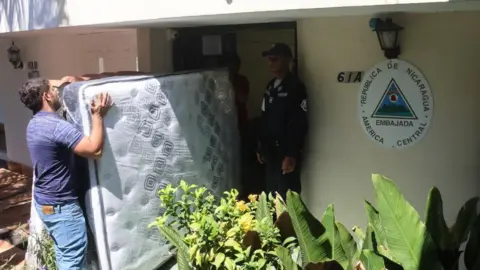 EPA Workers bring mattresses to the Nicaraguan Embassy as many items arrived for former president Ricardo Martinelli in Panama City, Panama, 08 February 2024.