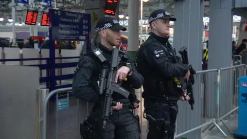 BBC British Transport Police armed counter-terrorism officers at Manchester's Piccadilly station