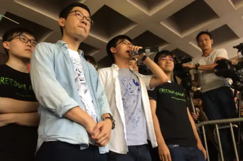 BBC Picture of activists Nathan Law, Joshua Wong and Alex Chow in Hong Kong