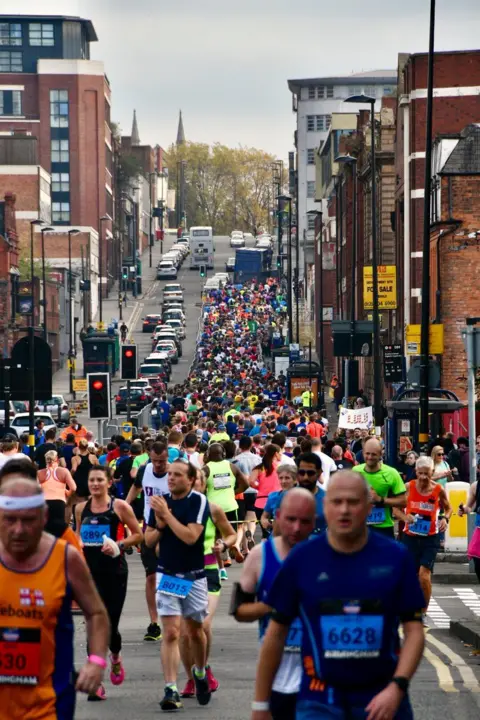Participants running through Digbeth
