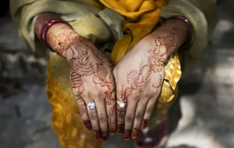 Getty Images Indian women often decorate their hands with henna on their wedding day