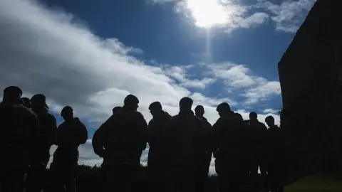 Getty Images Silhouette of soldiers