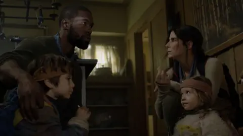 Netflix L-R: Julian Edwards, Trevante Rhodes, Sandra Bullock, Vivien Lyra Blair