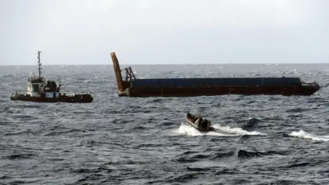 Royal Navy/PA Media Sinking ocean tug boat