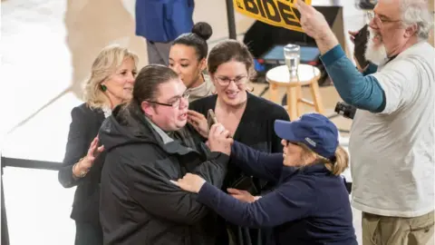 Getty Images Jill Biden helps escort a heckler out in February 2020