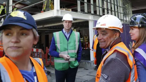 ADRIAN DENNIS/Getty Images Duke of Cambridge and workers