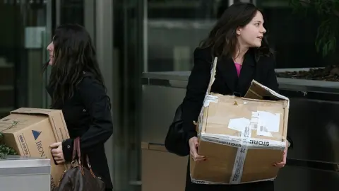 Getty Images Two women leave Lehmans with boxes