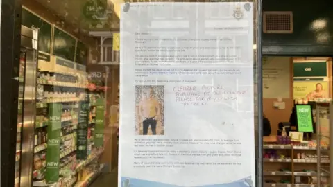 Wanted poster on display in a store