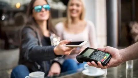 Getty Images Contactless payment on phone