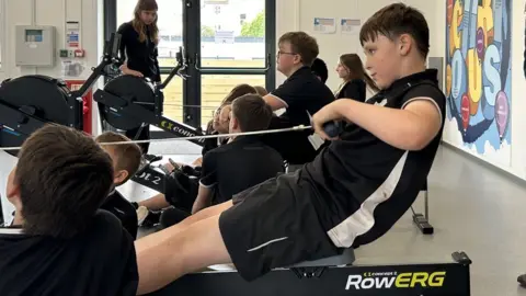 BBC Children on indoor rowing machines