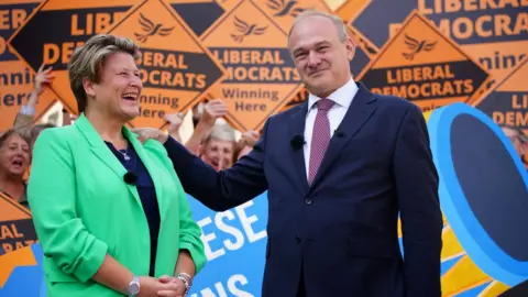 PA Media Ed Davey with Sarah Dyke