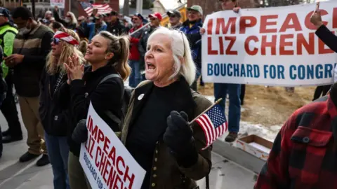 Getty Images People cheer as Rep. Matt Gaetz speaks to a crowd during a rally against Liz Cheney on 28 January in Wyoming