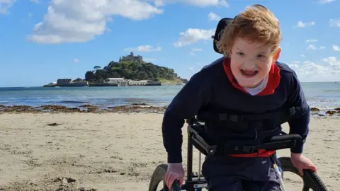 Family photo Freddie walking at St Michael's Mount