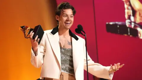 Getty Images Harry Styles accepts Album Of The Year for “Harry's House” onstage during the 65th GRAMMY Awards.