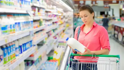 Getty Images Milk bottles display more health information than alcohol