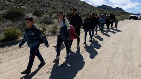 Getty Images Migrants at the border in February 2024