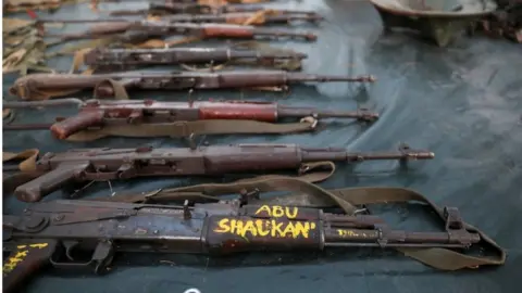 Reuters Weapons captured from militants, Mocímboa da Praia, Mozambique - 22 September 2021