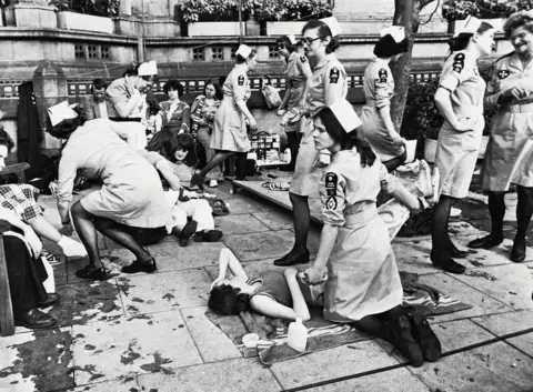 St John Ambulance Volunteers look after people with simulated illnesses